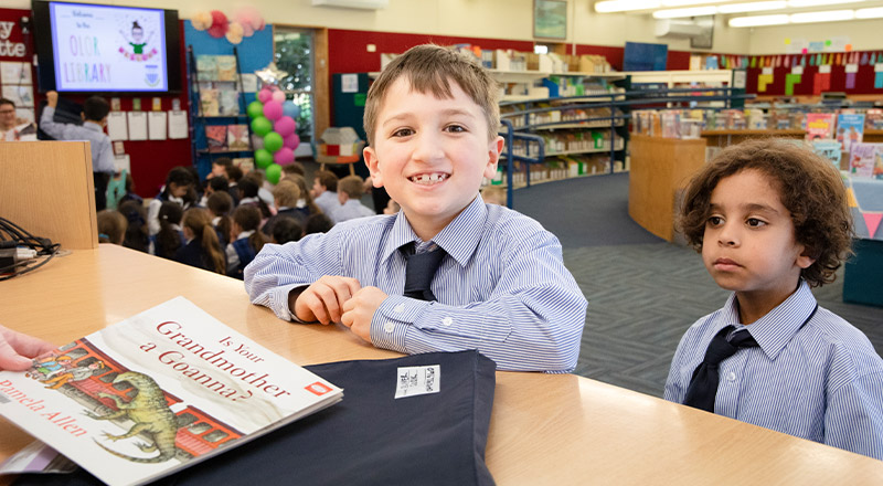 Students borrowing books from the library at Our Lady of The Rosary Primary School Kellyville