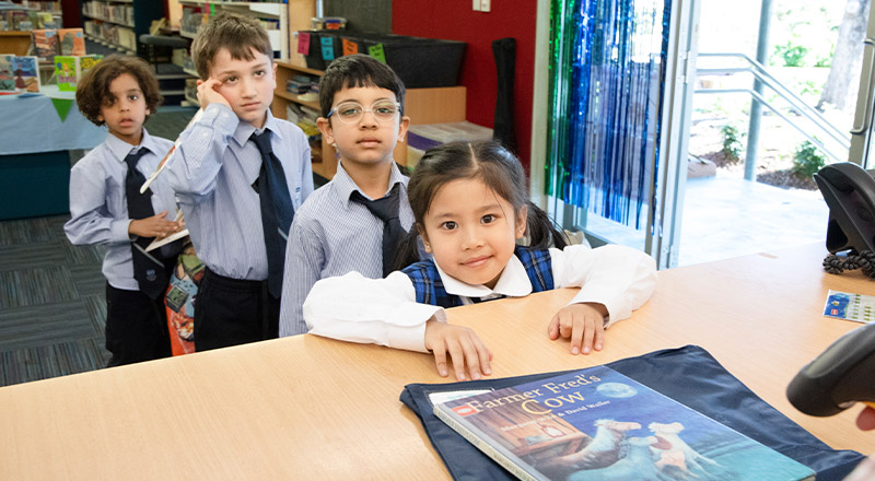 Students borrowing books from the library at Our Lady of The Rosary Primary School Kellyville
