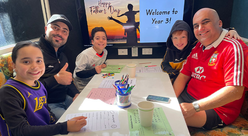 Students with their dads at a Fathers Day event at Our Lady of The Rosary Primary School Kellyville