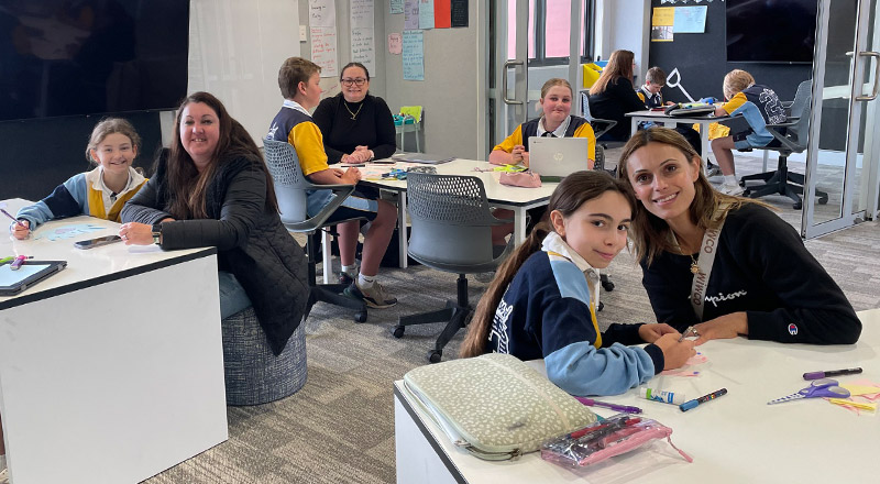 Students with their parents in the classroom during a school event at Our Lady of The Rosary Primary School Kellyville