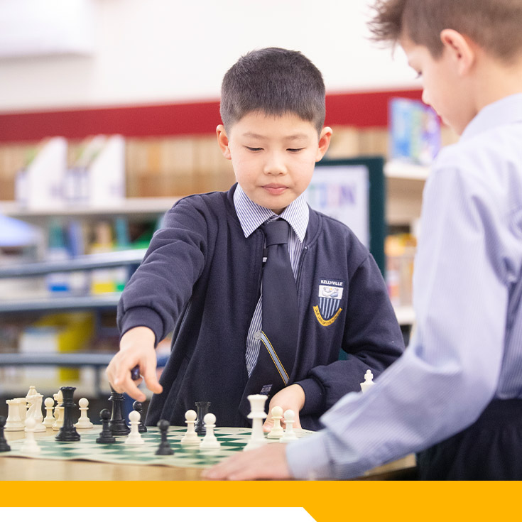 Students playing chess in the library at Our Lady of The Rosary Primary School Kellyville