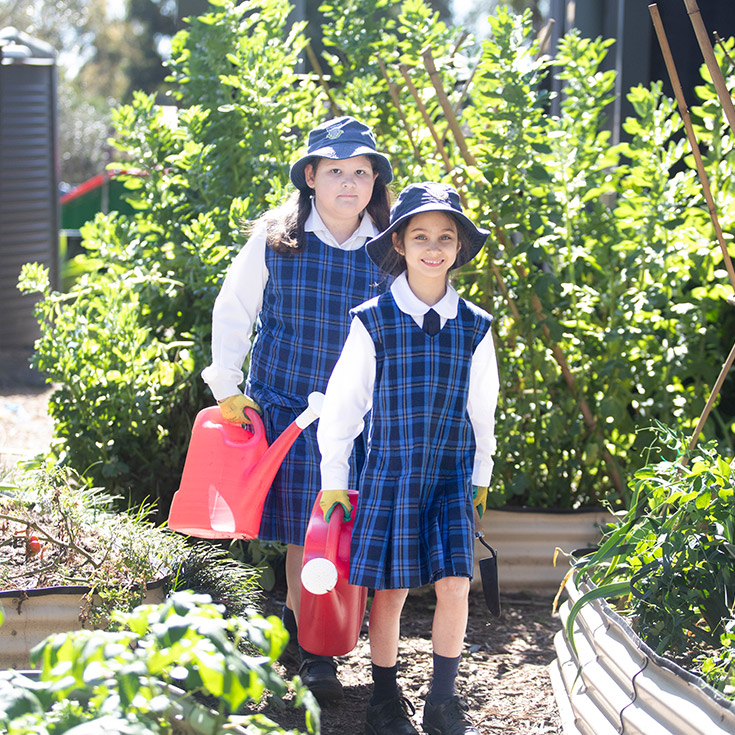 Students watering the school garden at Our Lady of The Rosary Primary School Kellyville